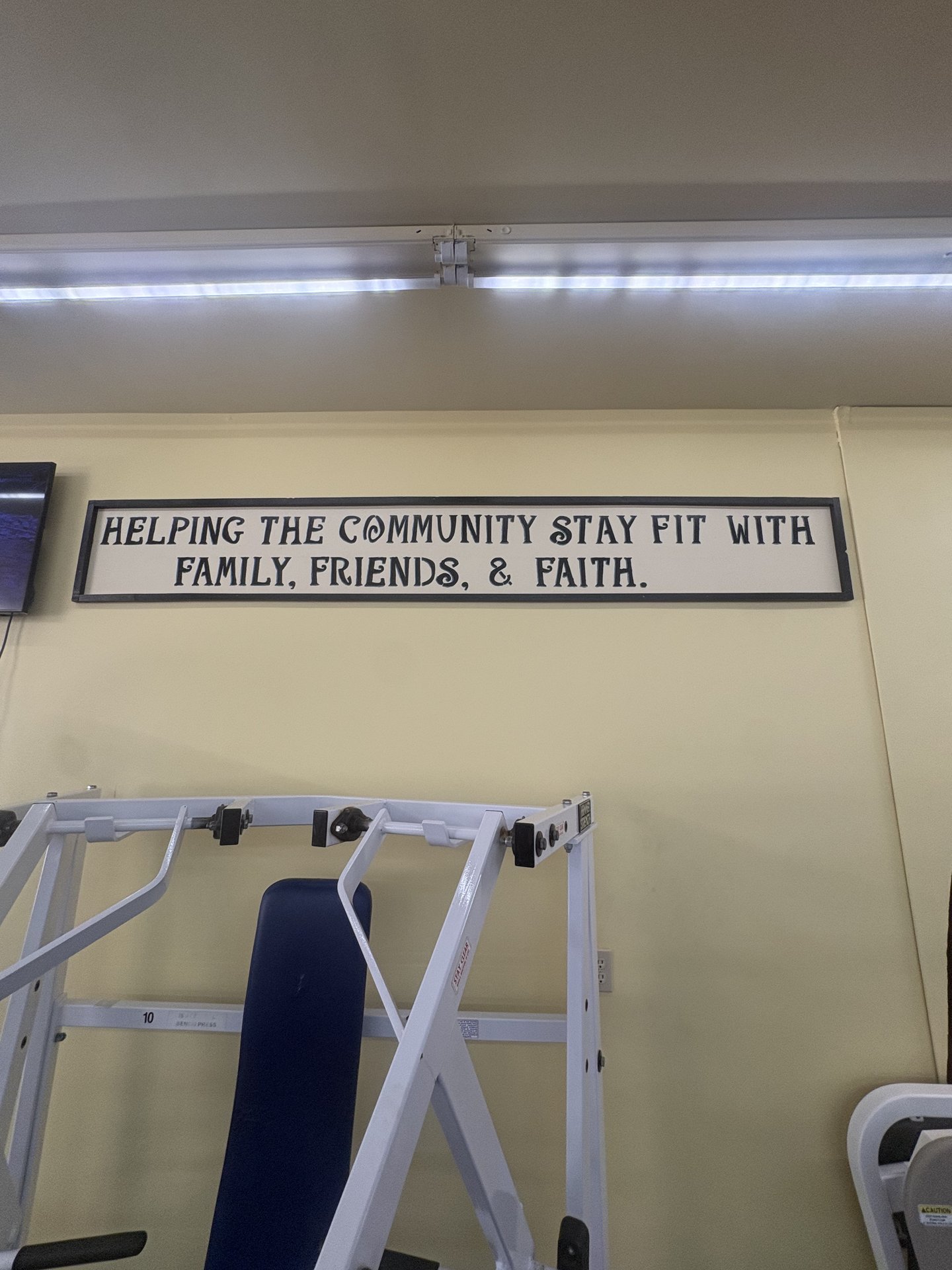 Sign reading Helping the community stay fit with family, friends and faith